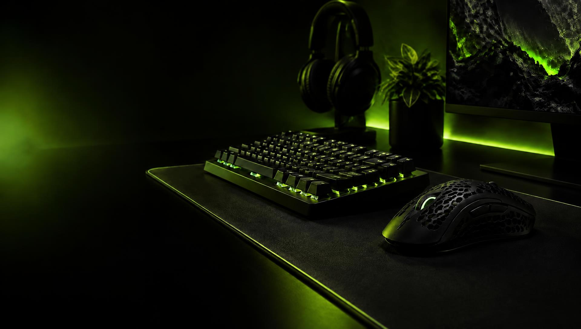Kryongear keyboard and wireless mouse on a desk lit in acid green